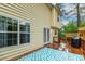 Exterior of the home featuring a wood deck, grill, second story, windows, and siding at 1984 Sadler Ave, Creedmoor, NC 27522