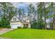 Charming home with manicured front lawn and mature trees, providing a serene setting at 1984 Sadler Ave, Creedmoor, NC 27522