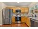 Well-equipped kitchen boasts stainless appliances and ample counter space for meal preparation at 1984 Sadler Ave, Creedmoor, NC 27522