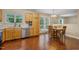 Spacious kitchen/dining area with modern dishwasher, cabinets, double sink and view to outdoor spaces at 1984 Sadler Ave, Creedmoor, NC 27522