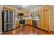 Well-lit kitchen featuring stainless steel appliances, wood cabinets, and generous counter space at 1984 Sadler Ave, Creedmoor, NC 27522