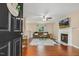 Open living room showcasing hardwood floors, a fireplace, and comfortable seating area at 1984 Sadler Ave, Creedmoor, NC 27522