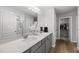 A bathroom featuring double sinks, quartz countertops, and tile flooring at 200 Gill Farm Way, Franklinton, NC 27525