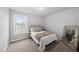 A bedroom featuring carpeted floors, a comfortable bed and a window with a view at 200 Gill Farm Way, Franklinton, NC 27525