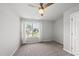 A bright bedroom features carpeted floors, a bed, a window, and neutral walls at 200 Gill Farm Way, Franklinton, NC 27525