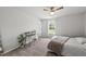 A bedroom with a desk beside a window with natural light and a ceiling fan at 200 Gill Farm Way, Franklinton, NC 27525