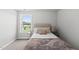 A cozy bedroom featuring carpeted floors, a comfortable bed and a window with a view at 200 Gill Farm Way, Franklinton, NC 27525