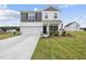 Charming two-story home with a manicured lawn, attached garage and welcoming front porch at 200 Gill Farm Way, Franklinton, NC 27525