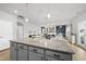 Open kitchen design with granite countertops and modern cabinetry overlooking a cozy living space at 200 Gill Farm Way, Franklinton, NC 27525