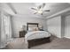 A well-lit main bedroom features an upholstered headboard and ceiling fan at 200 Gill Farm Way, Franklinton, NC 27525