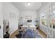 Bright home office with hardwood floors, modern desk, open shelving and natural light at 200 Gill Farm Way, Franklinton, NC 27525