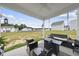 Inviting patio with a swing, seating area, and pleasant backyard view at 200 Gill Farm Way, Franklinton, NC 27525