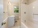 Well-maintained bathroom featuring a tub and shower combination, a sink, and a window for natural light at 2015 Walnut St, Durham, NC 27705