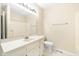 Bathroom featuring a vanity, toilet, mirror and shower at 2015 Walnut St, Durham, NC 27705