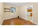 Cozy bedroom with hardwood floors and a window overlooking the backyard, creating a peaceful retreat at 2015 Walnut St, Durham, NC 27705