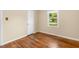 Bedroom with hardwood floors, natural light, neutral walls, and a closet at 2015 Walnut St, Durham, NC 27705