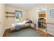 Inviting bedroom with hardwood floors, natural light, and contemporary decor at 2015 Walnut St, Durham, NC 27705