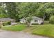 Charming single-story home with a well-maintained front yard and mature trees at 2015 Walnut St, Durham, NC 27705