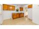 Functional kitchen space featuring wood cabinets, a sink, and a convenient layout for cooking and meal preparation at 2015 Walnut St, Durham, NC 27705