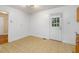 Kitchen area with a functional layout, featuring a door to the backyard and a window for natural light at 2015 Walnut St, Durham, NC 27705