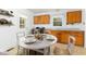 Cozy kitchen with dining area, featuring wood cabinets and natural light at 2015 Walnut St, Durham, NC 27705