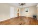 Spacious living room with hardwood floors, neutral paint, and a glimpse into the adjacent kitchen at 2015 Walnut St, Durham, NC 27705