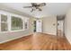 Bright living room with hardwood floors, a ceiling fan, and a view of the front yard through the window at 2015 Walnut St, Durham, NC 27705