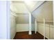 Bright attic room with wood floors, closet shelving, and plenty of storage space at 208 Glenn St, Franklinton, NC 27525