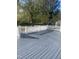 Grey painted wood deck with white railings and multiple access points at 208 Glenn St, Franklinton, NC 27525