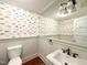 Charming bathroom with blue fish wallpaper at 208 Glenn St, Franklinton, NC 27525