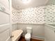Bathroom with vintage-style tub and blue fish wallpaper at 208 Glenn St, Franklinton, NC 27525