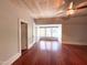 Large bedroom featuring hardwood floors and a window seat, perfect for relaxation at 208 Glenn St, Franklinton, NC 27525