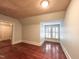 Bedroom featuring a wood ceiling, hardwood floors and natural light from shuttered window at 208 Glenn St, Franklinton, NC 27525