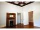 Bedroom with a fireplace, ceiling fan, hardwood floors and lots of natural light at 208 Glenn St, Franklinton, NC 27525