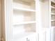 Close-up of empty built-in shelving with cabinets and ornate hardware at 208 Glenn St, Franklinton, NC 27525