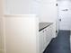 Entryway features white cabinets and gray countertops at 208 Glenn St, Franklinton, NC 27525
