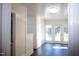Bright entryway with tile floors, white wainscoting, and sunlit windows at 208 Glenn St, Franklinton, NC 27525