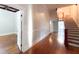 Spacious foyer with hardwood floors and staircase leading to other rooms at 208 Glenn St, Franklinton, NC 27525