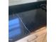 Close-up of the kitchen's black granite countertops and stainless steel hardware at 208 Glenn St, Franklinton, NC 27525