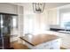 Updated kitchen featuring stainless steel appliances, a butcher block island, and custom cabinets at 208 Glenn St, Franklinton, NC 27525