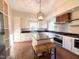 Spacious kitchen with stainless steel appliances, granite countertops, and hardwood floors at 208 Glenn St, Franklinton, NC 27525