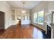 View of living room featuring hardwood floors, fireplace, built-in shelves, and natural light at 208 Glenn St, Franklinton, NC 27525