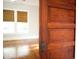 Living room entrance featuring hardwood floors, window, and wooden sliding door at 208 Glenn St, Franklinton, NC 27525