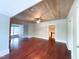 Spacious living room featuring wood floors, a wooden ceiling, and a modern ceiling fan at 208 Glenn St, Franklinton, NC 27525
