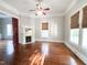 Living room featuring hardwood floors and natural light from multiple windows at 208 Glenn St, Franklinton, NC 27525