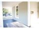 Covered porch with painted wood flooring and craftsman style rails and posts at 208 Glenn St, Franklinton, NC 27525