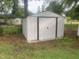 Outdoor shed on grassy lot with secure door, providing ample storage at 208 Glenn St, Franklinton, NC 27525