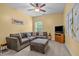 Spacious bonus room features a sectional sofa, TV, and neutral carpet at 21 Botanical Way, Pittsboro, NC 27312
