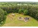 Community park with playground, picnic pavilion, trellised swing set surrounded by mature trees at 21 Botanical Way, Pittsboro, NC 27312