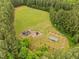 Aerial view of the community park, featuring playground, picnic pavilion and trellised swing set at 21 Botanical Way, Pittsboro, NC 27312